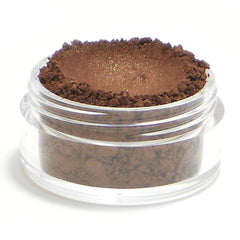 Side view of Legend Vegan Mineral Eyeshadow in bronze shimmer showing pressed powder texture and compact size