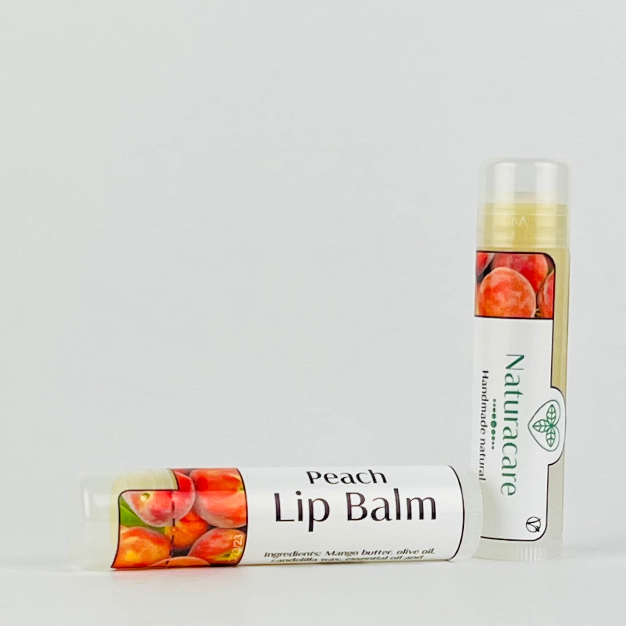 Peach Lip Balm, white tube with peach graphic, "Naturacare" brand, for lip care