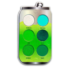 Eyeshadow palette in can shape with silver, green, and teal colors, with text labels