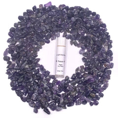Lip balm tube with white label, purple stones, Aura Light Apothecary branding