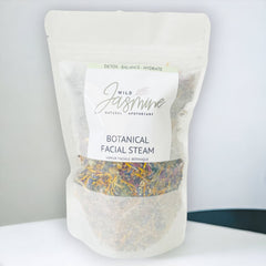 Facial steam bag, white paper bag, colorful dried herbs, Wild Jasmine branding visible