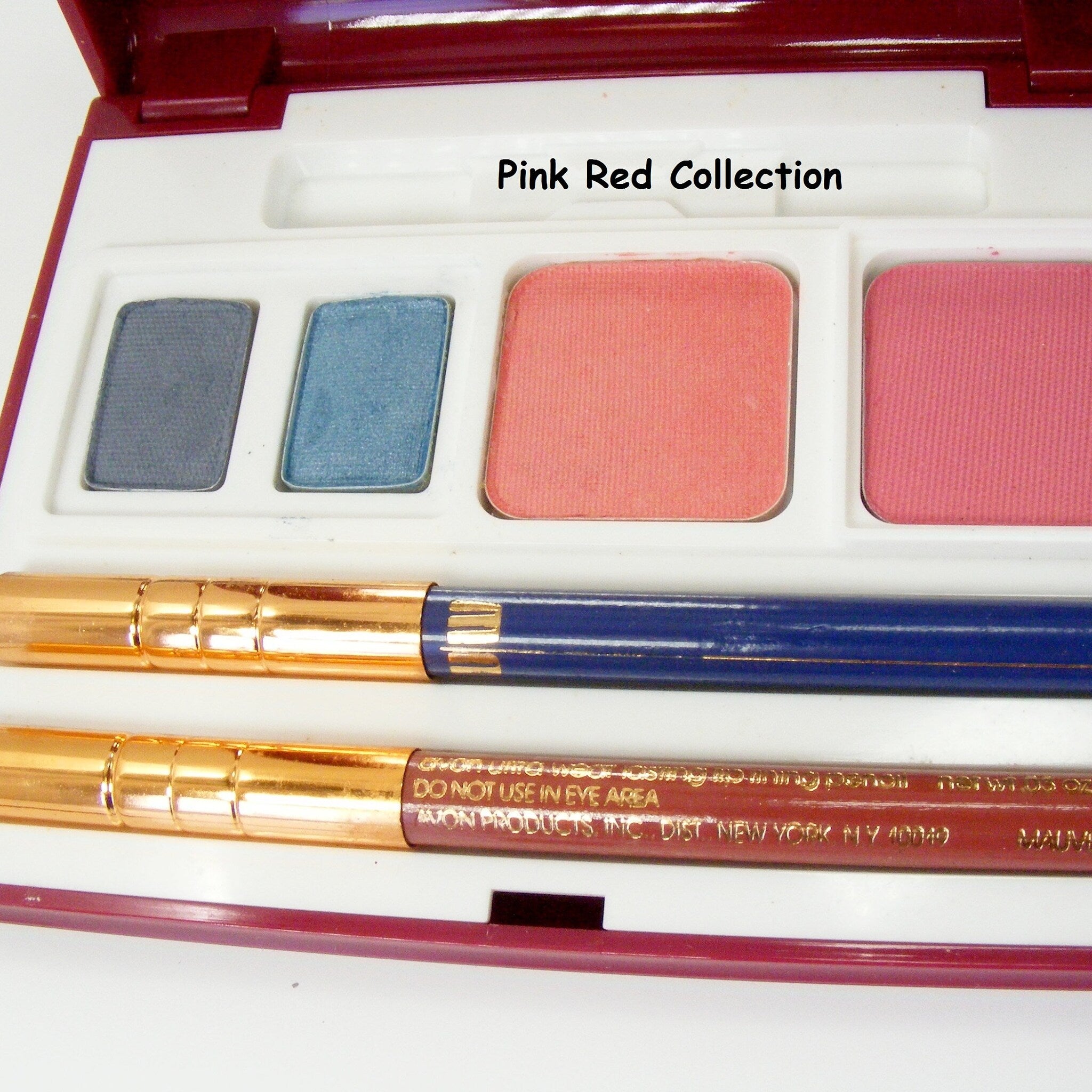 Side view of Avon Ultra Wear Eye Shadow palette showing multi-shade color gradient and compact case texture