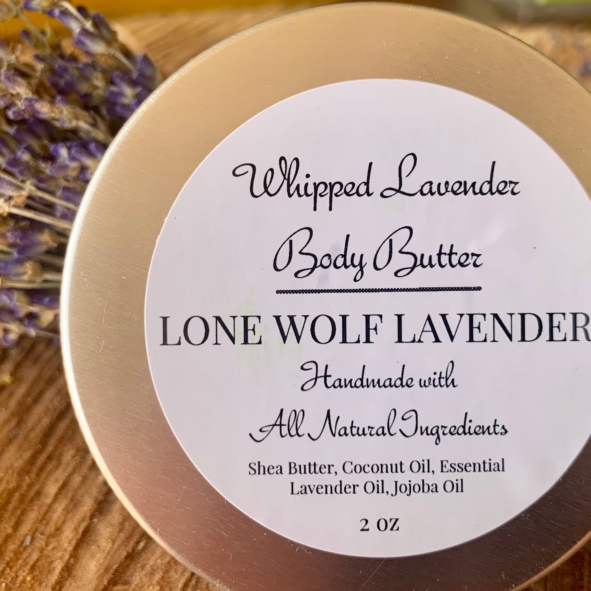Close-up of lavender whipped body butter in a white jar, showcasing its rich, creamy texture and natural ingredients for dry skin.
