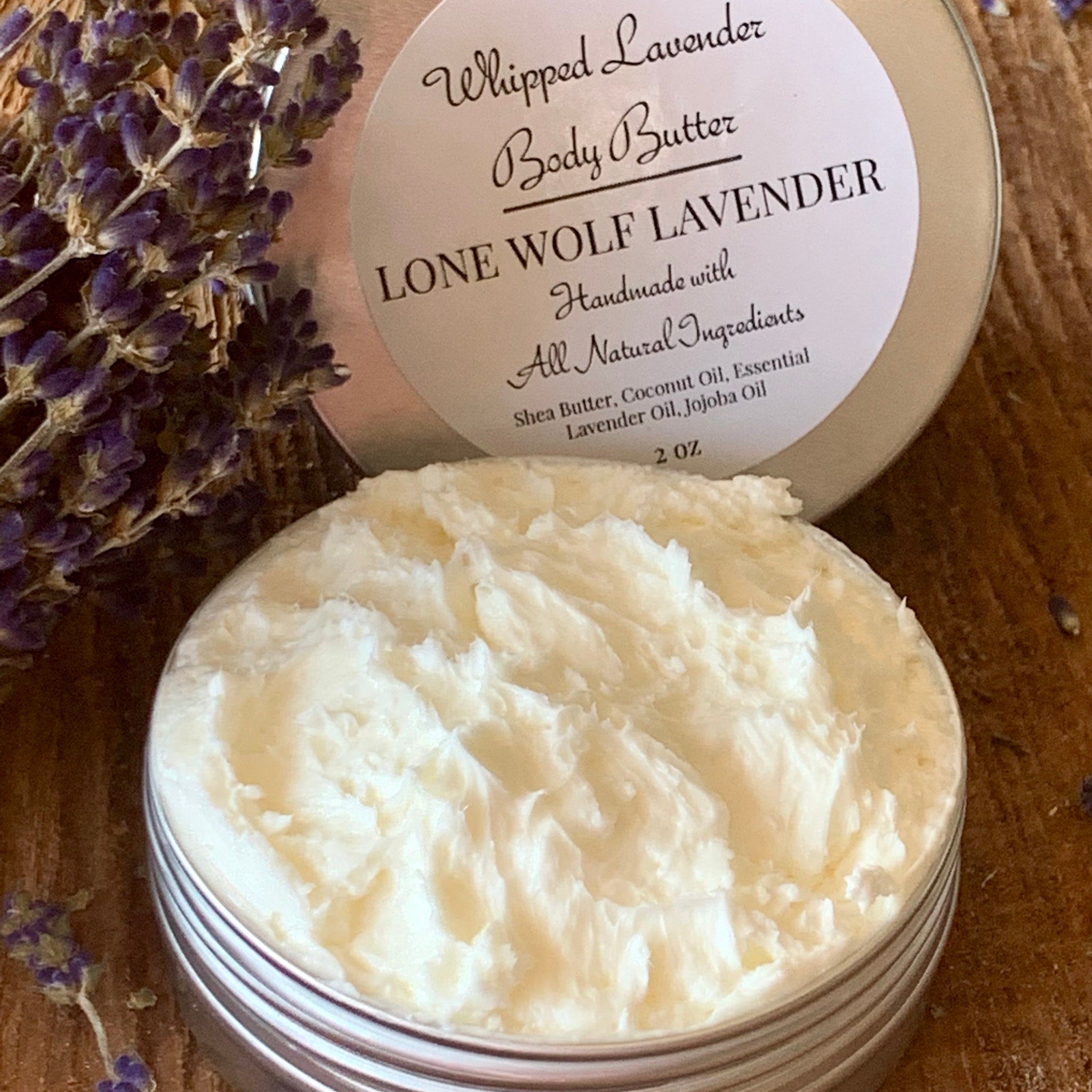 Side view of lavender whipped body butter in white tub with natural label, showcasing rich texture