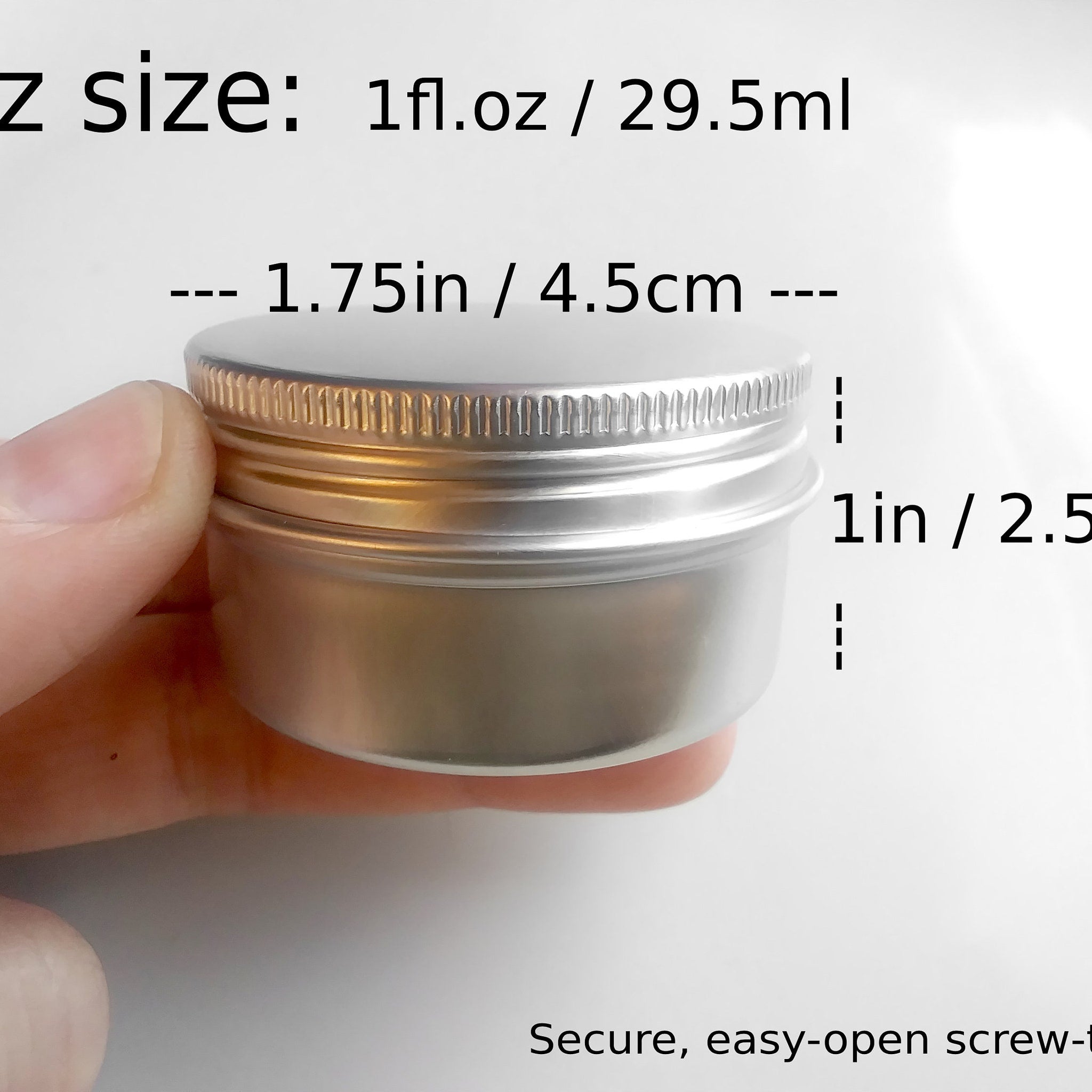 Aluminum container with silver lid and screw top, held by hand, for storage