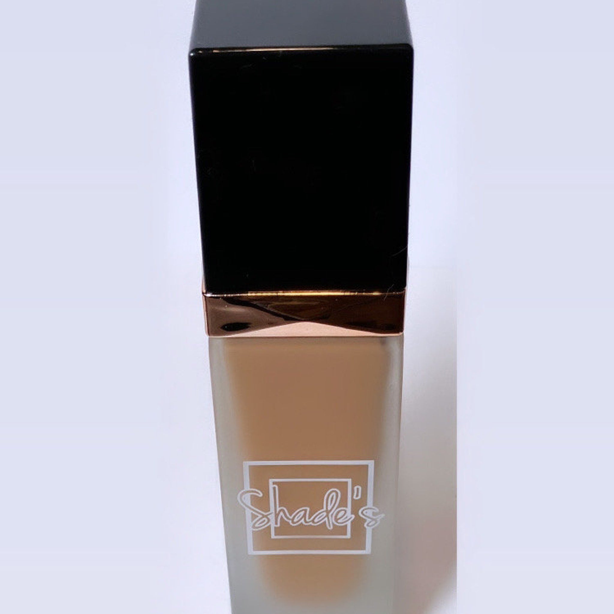Side view of Shade-Perfect Foundation compact showing smooth matte finish and precise color gradient