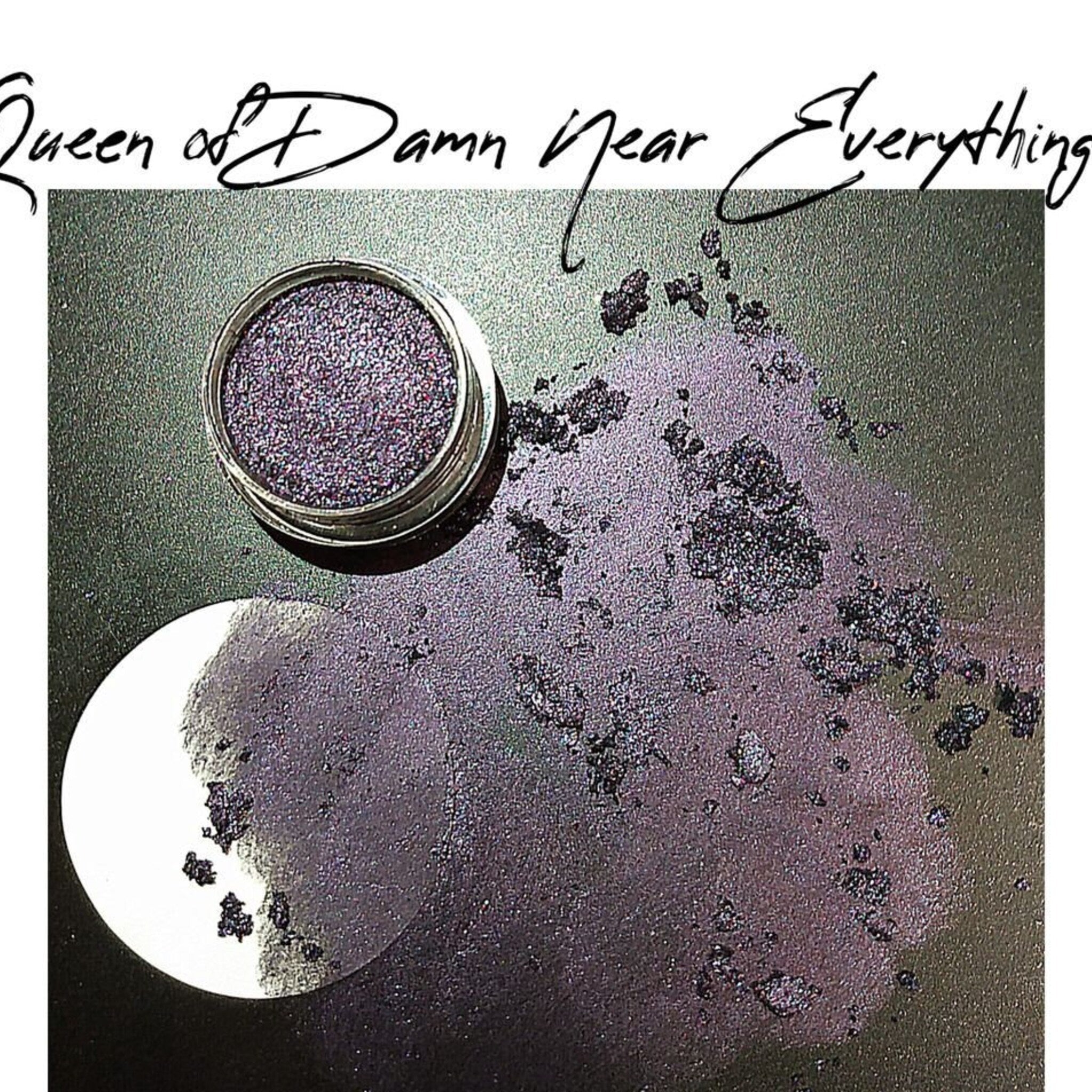 Queen of Damn Near Everything eyeshadow palette with vibrant jewel-toned shades in sleek black compact