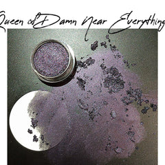 Queen of Damn Near Everything eyeshadow palette with vibrant jewel-toned shades in sleek black compact