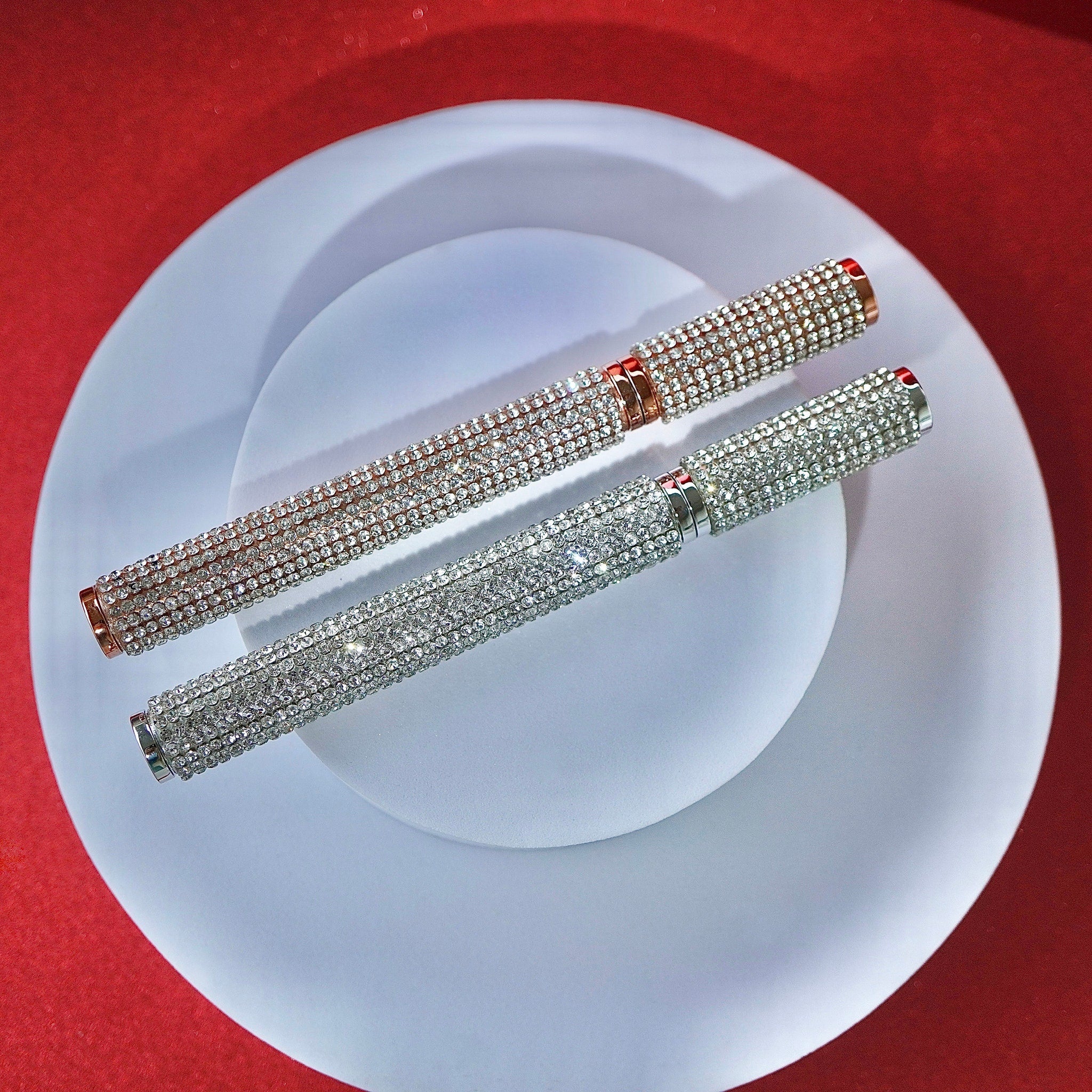 Eyeliner pens with silver and rose gold metal, covered in rhinestones