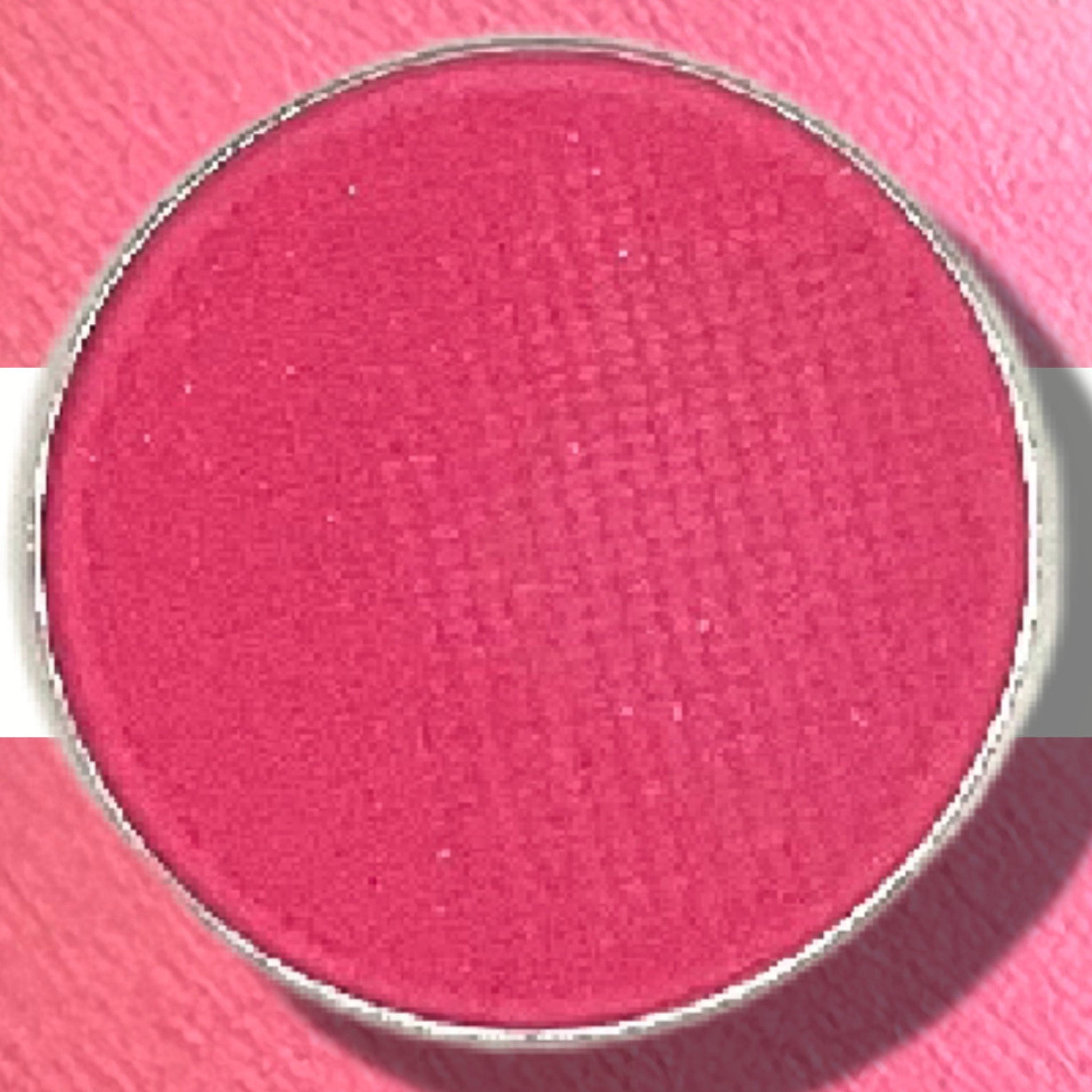 Eyeshadow pan with matte magenta color and silver metal rim, for eye makeup application