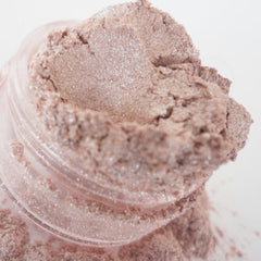 Side view of luminous white and pale pink mineral eyeshadow duo with shimmer finish in compact case