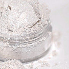 Close-up of shimmering white and pale pink mineral eyeshadow with sparkling fairy glow finish