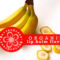 Lip balm flavor oil with yellow bananas and red Butter Cress logo on white background