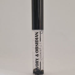 Lip gloss tube with black cap, clear gloss, and Ivory & Obsidian Cosmetics text
