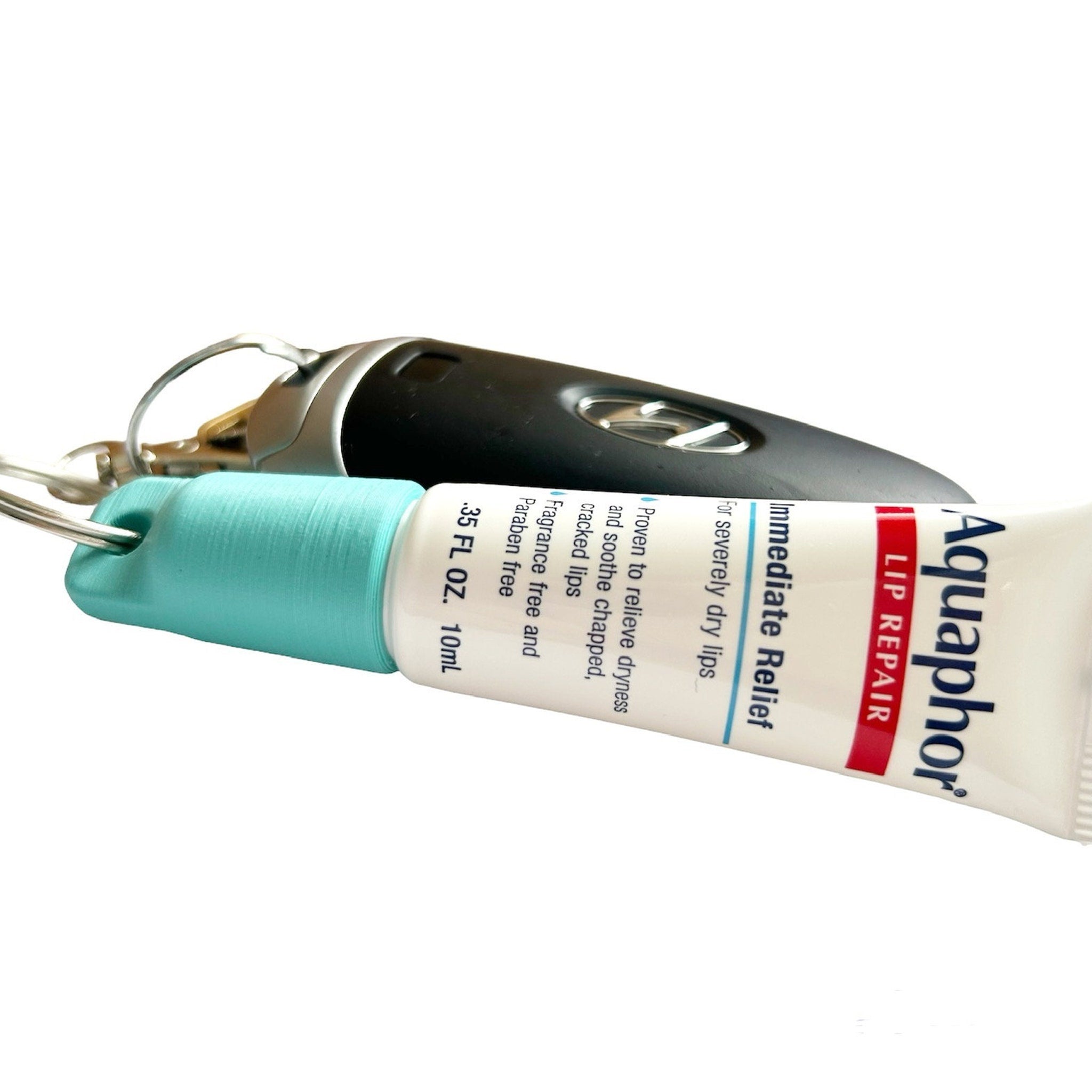 Aquaphor lip repair tube, white and red label, blue cap, with car key fob