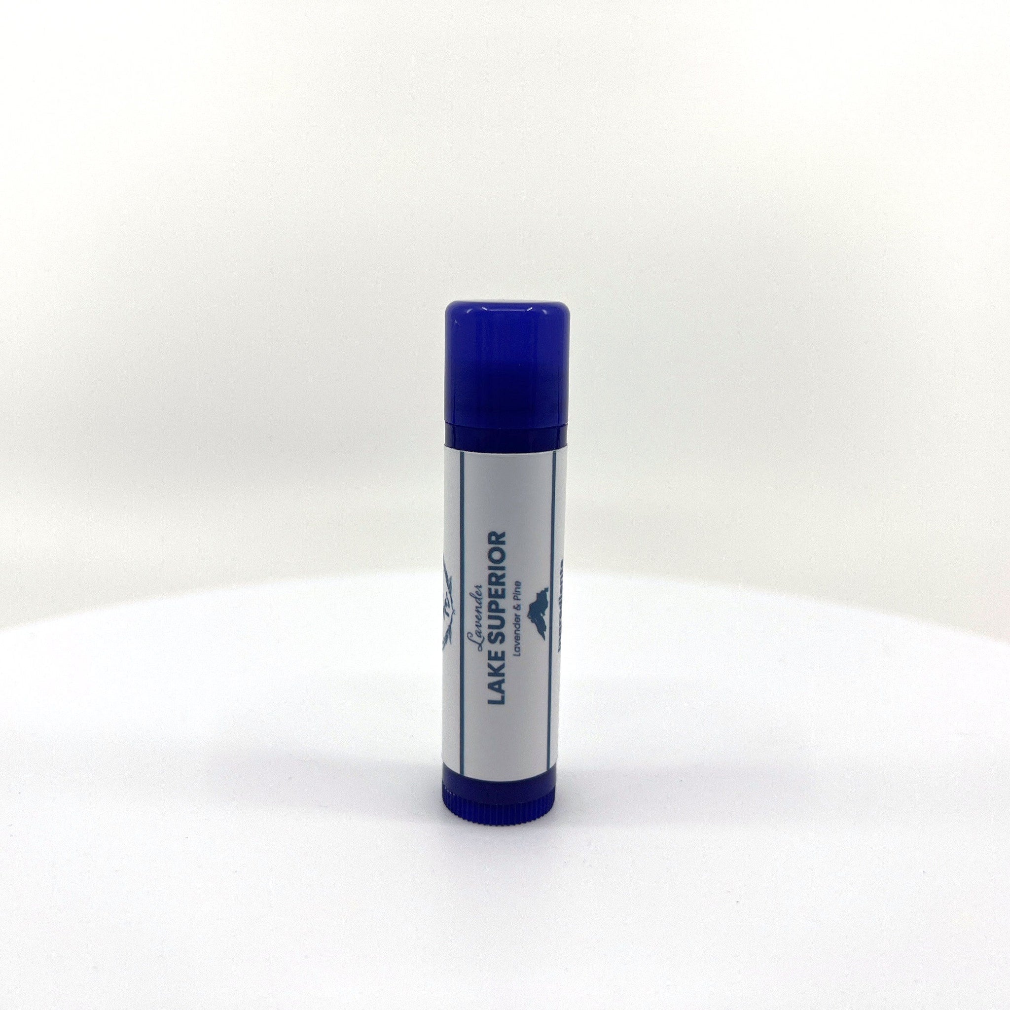 Lip balm tube with blue cap and label, white and blue text, "Lake Superior" brand