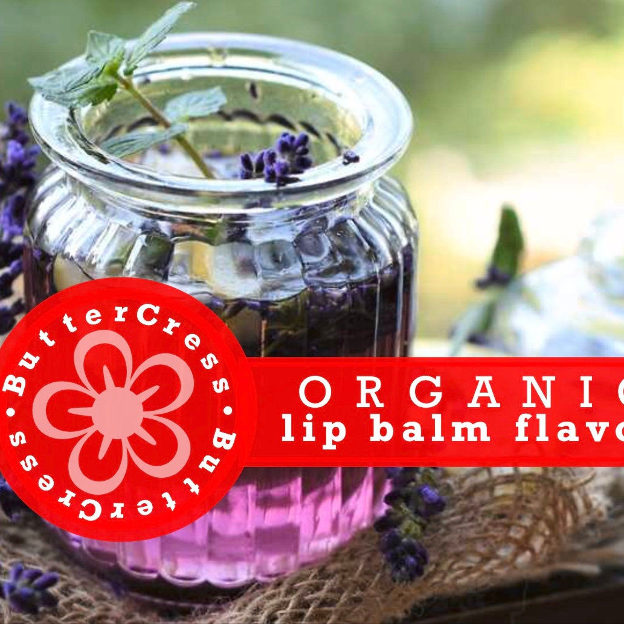 Lip balm flavor oil in a glass jar with purple flowers and Butter Cress logo on red banner
