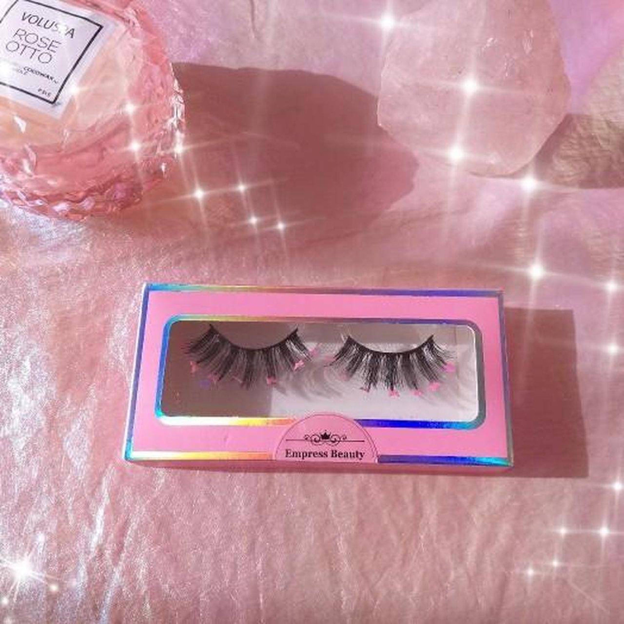 False eyelashes in pink box with black lashes and pink accents, Empress Beauty brand