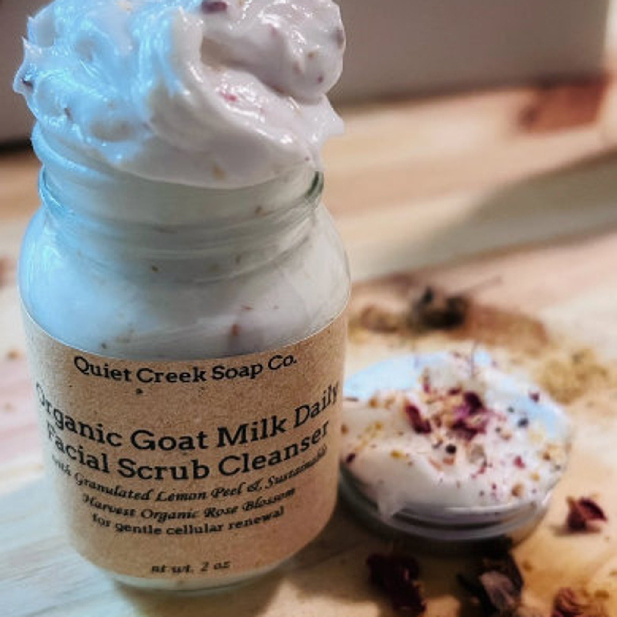 Facial scrub cleanser in glass jar with white cream and brown label Quiet Creek Soap Co.