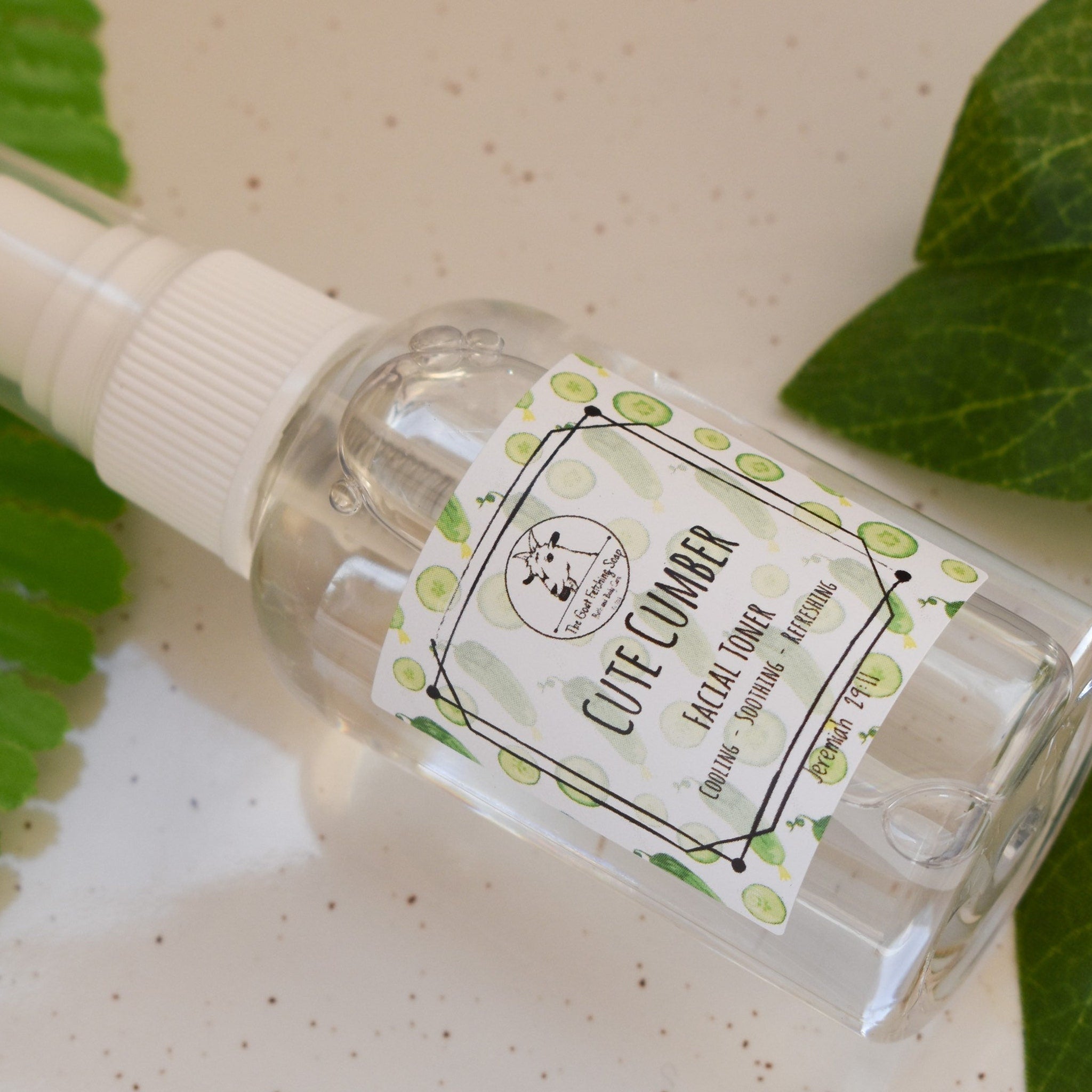 Facial toner bottle with clear liquid, white cap, and label with cucumber pattern and brand name "Cute Cumber