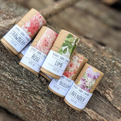 Botany Barn Canada products, various floral patterned paper wrap, brown cardboard tubes, white labels with text