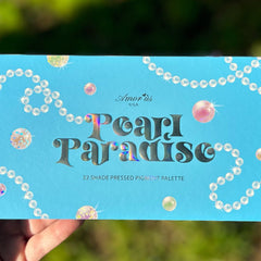 Side view of Pearl Paradise Eyeshadow Palette showcasing six shimmering shades in pink, gold, and bronze tones