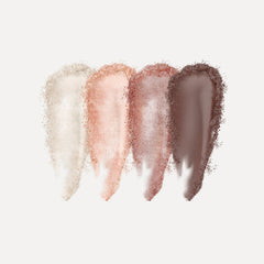 Close-up of shimmering bronze and taupe eye shadow palette with smooth, blendable powder texture