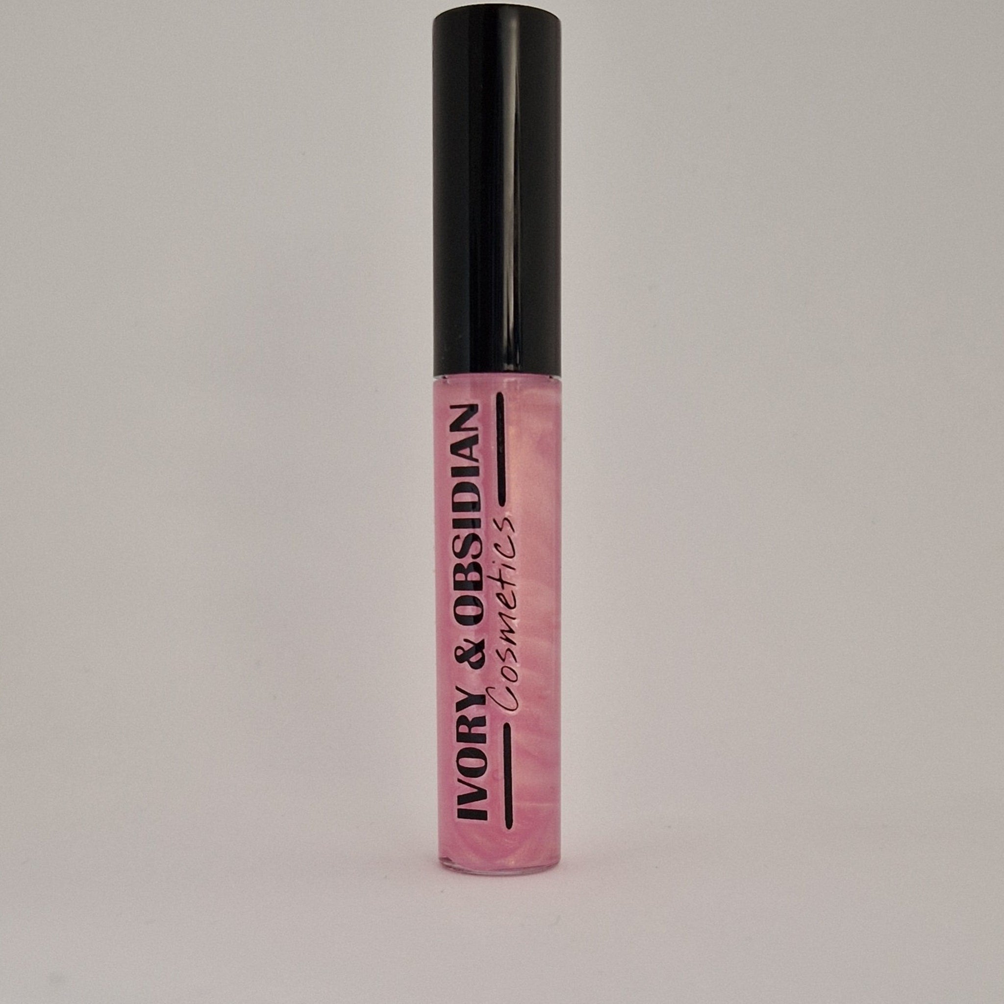 Lip gloss tube with black cap, pink iridescent gloss, and Ivory & Obsidian Cosmetics text