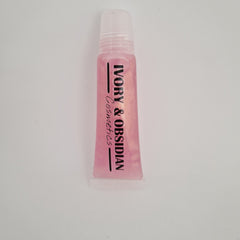 Lip gloss tube with pink liquid, white cap, and Ivory & Obsidian Cosmetics text