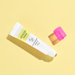 Eye cream tube, white and yellow, pink cap, ARTISTRY STUDIO text