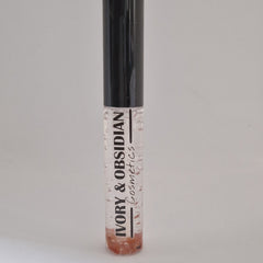 Lip gloss tube with clear liquid, black cap, and Ivory & Obsidian Cosmetics text
