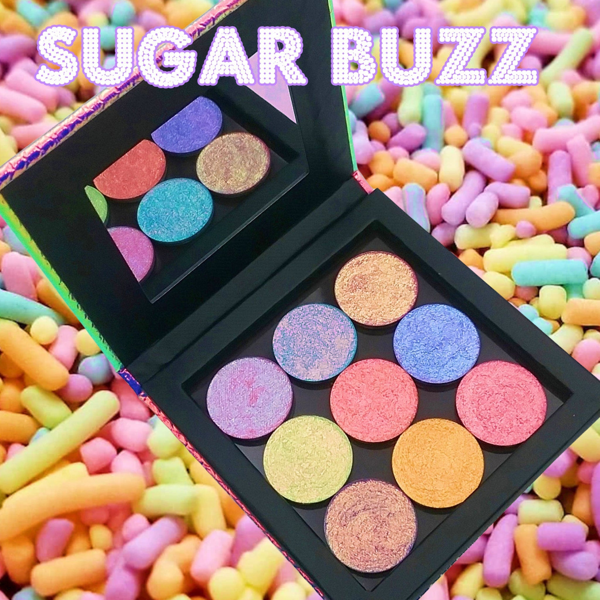 Swatch of multichrome eyeshadow shifting from emerald green to sapphire blue in Sugar Buzz Collection