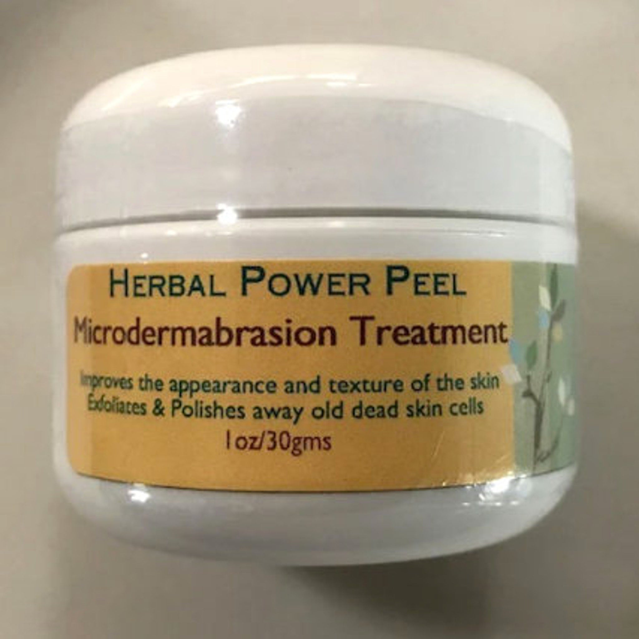 Microdermabrasion treatment jar, white plastic container with yellow label, Herbal Power Peel text visible