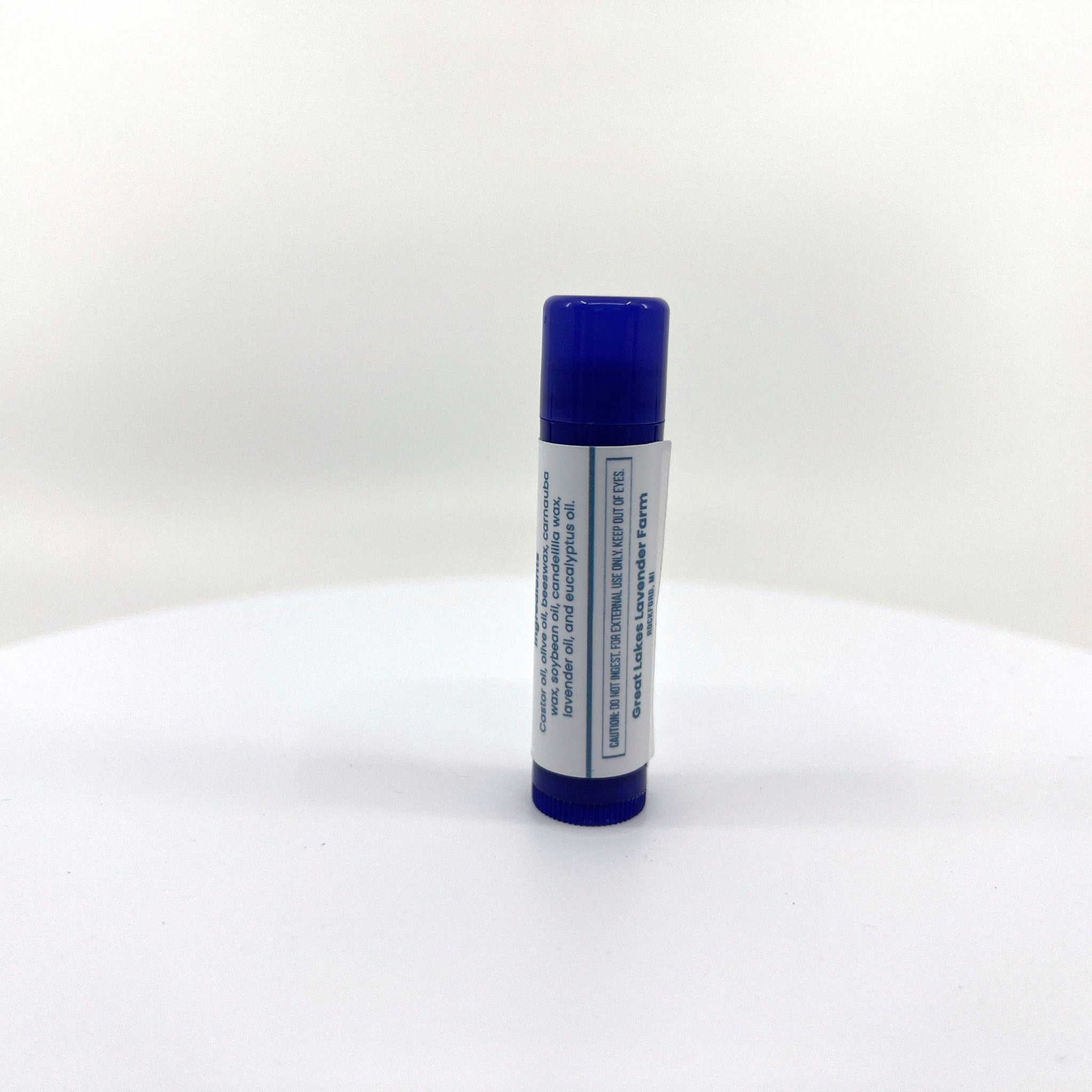 Lip balm tube with blue cap and white label, Great Lakes Lavender Farm brand