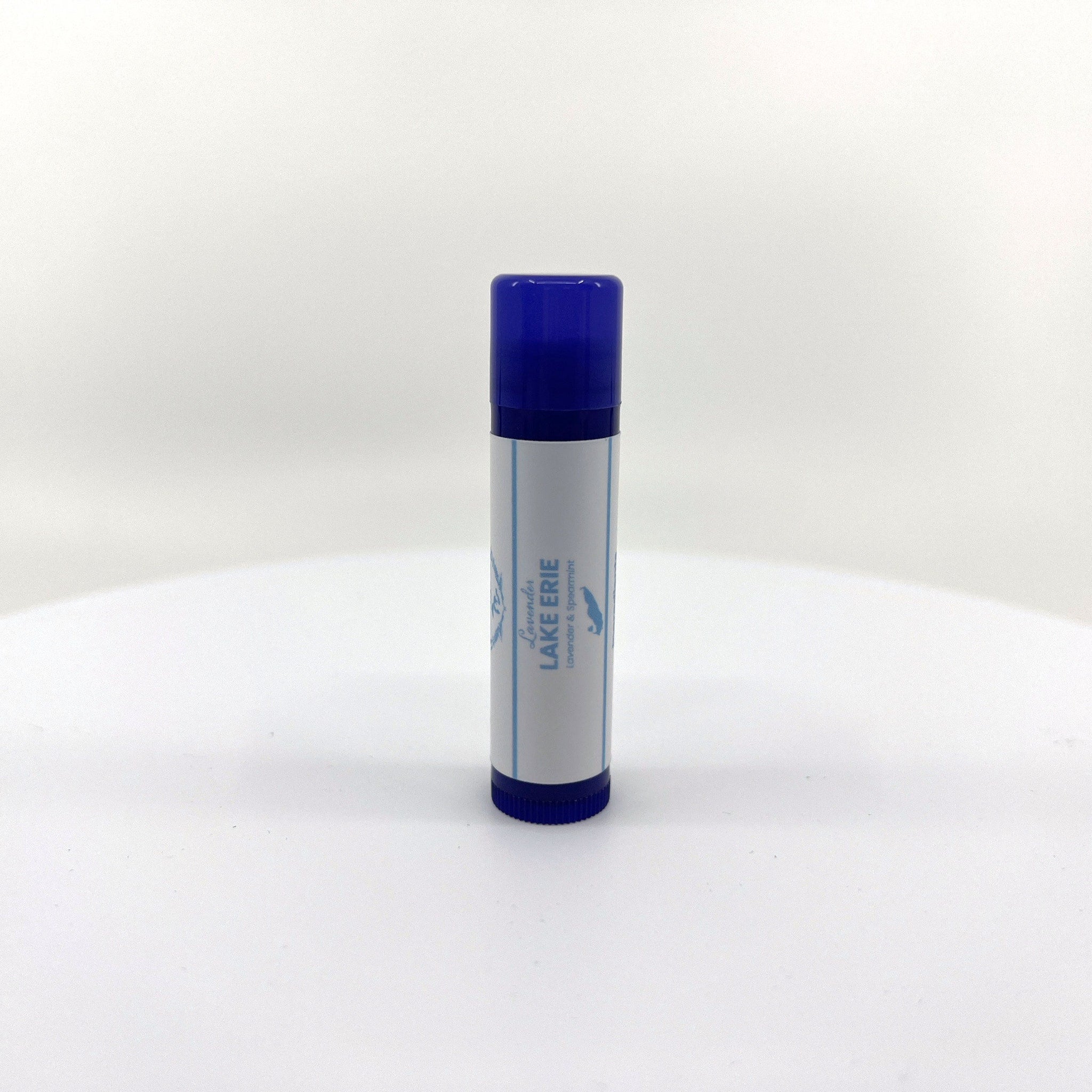 Lip balm tube with blue cap, white label, and Lavender Lake Erie text