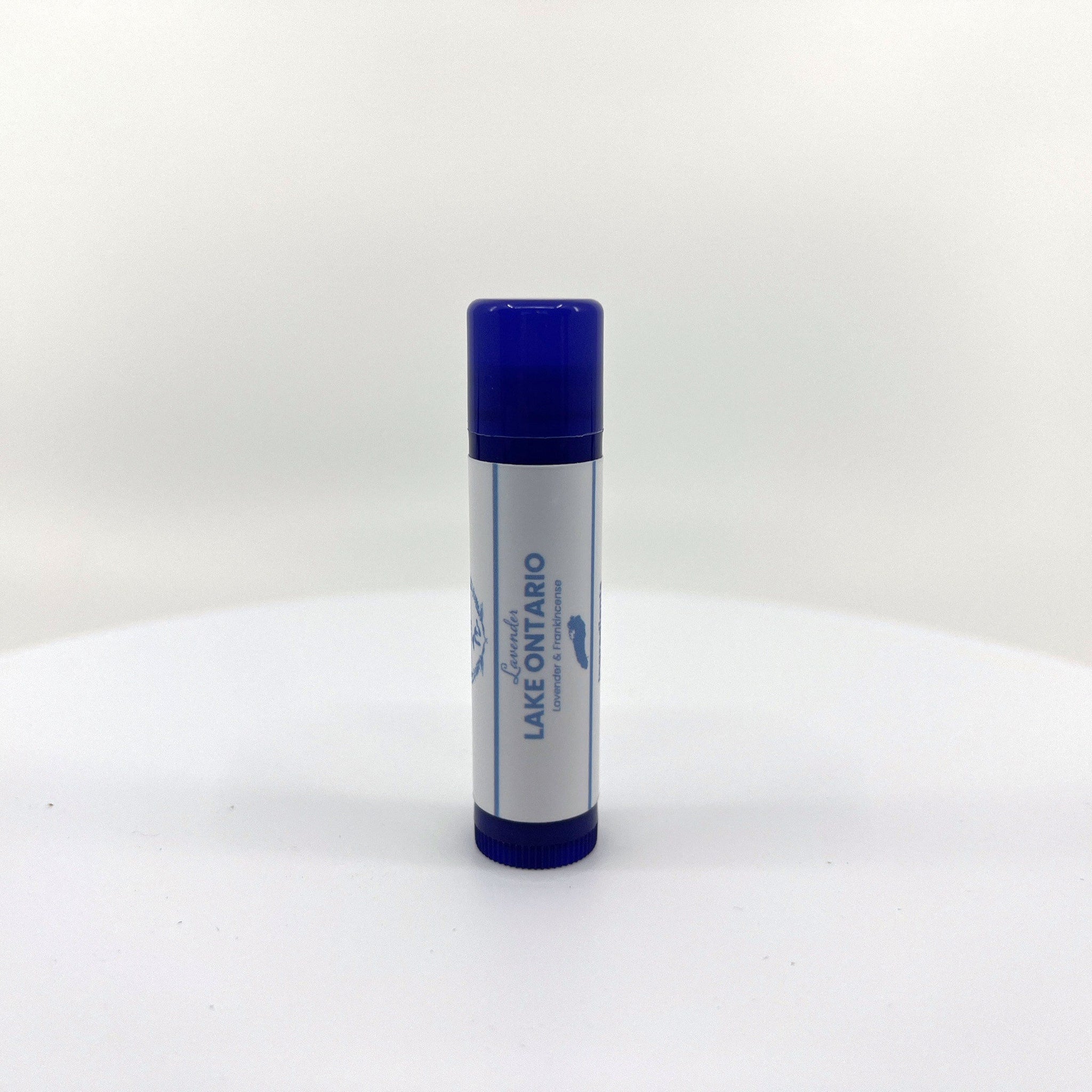 Lip balm tube with blue cap and white label, "Lake Ontario" text visible