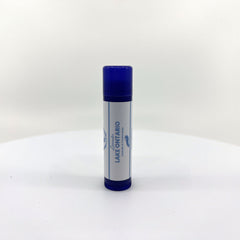 Lip balm tube with blue cap and white label, "Lake Ontario" text visible