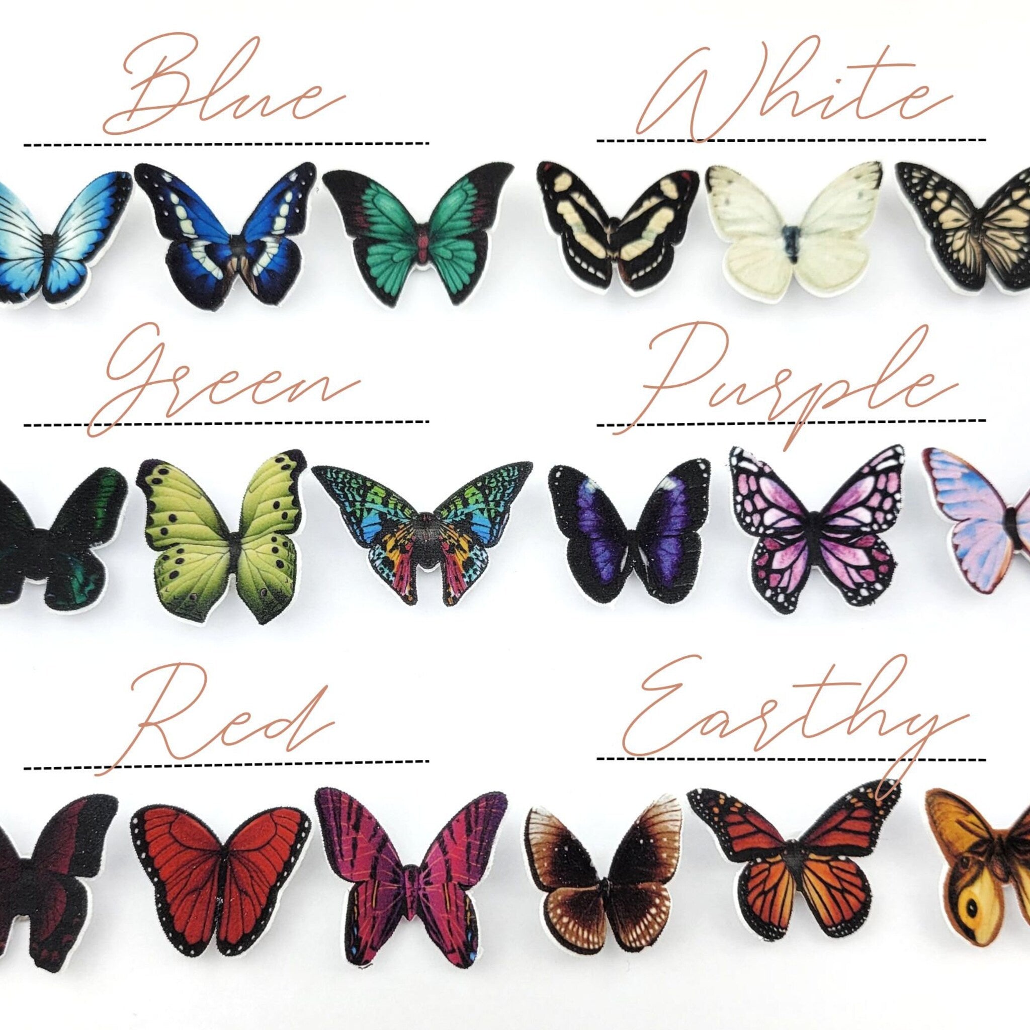 Close-up of white glitter butterfly eyeshadow decals with delicate wing details on clear adhesive backing