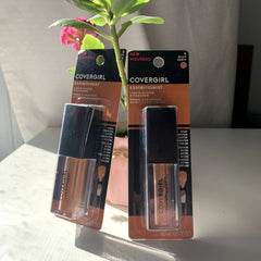 Close-up of CoverGirl Gilty Party liquid glitter eye shadow trio showing vibrant metallic shades in gold, bronze, and rose