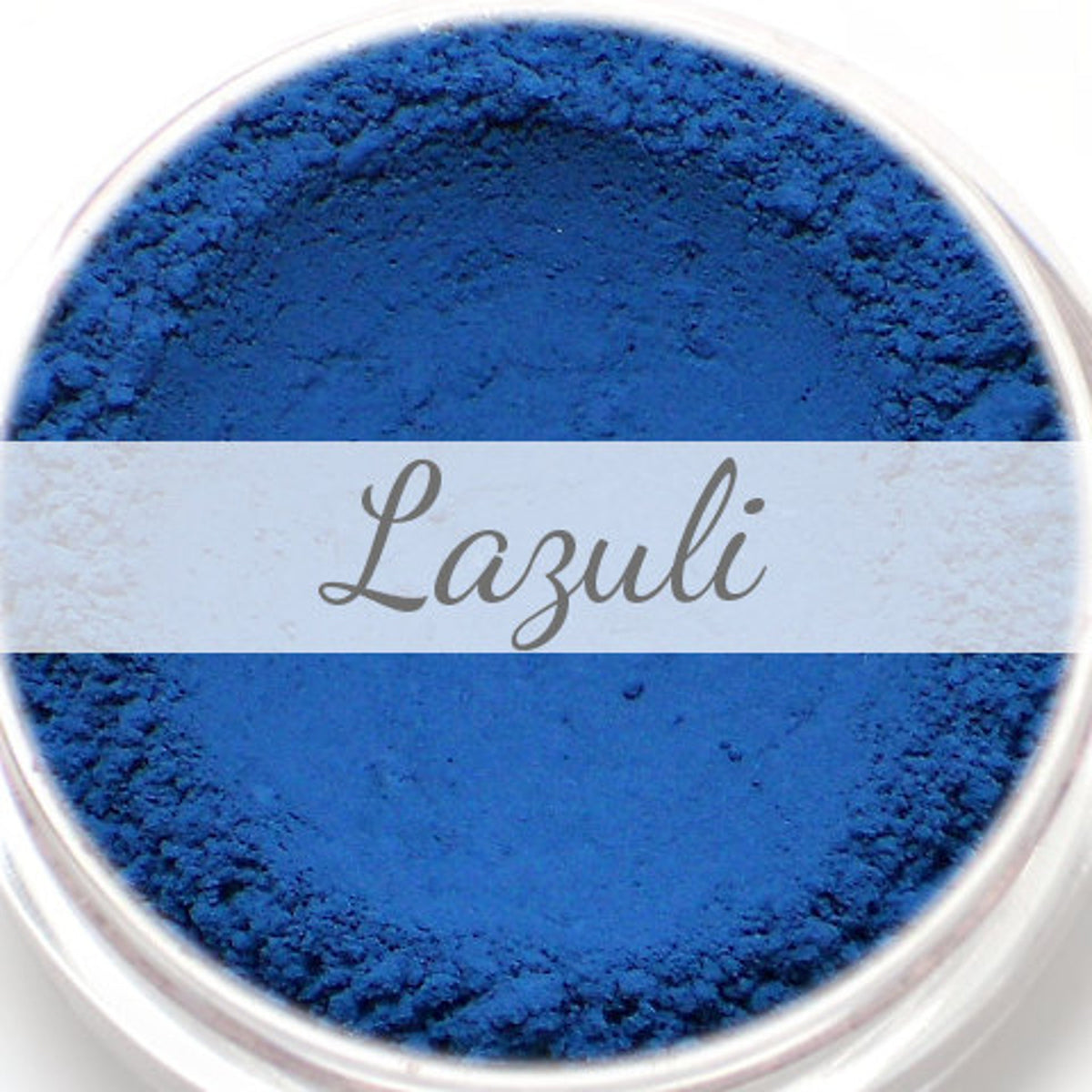 Close-up of matte blue Lazuli vegan mineral eyeshadow sample in round compact with smooth powder texture
