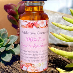 Skin care rose hip oil bottle, amber glass, floral label with text