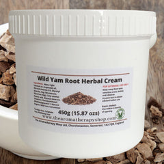 Close-up of creamy wild yam root treatment being gently smoothed onto glowing skin with fingertips