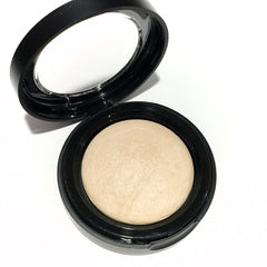 French Vanilla baked eye shadow in a round compact with warm nude shimmer and botanical ingredients