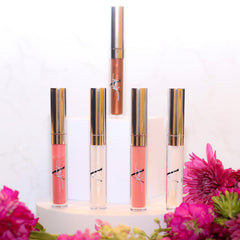 Lip gloss tubes with silver caps, clear tubes, and various shades of gloss, Monet brand visible