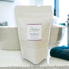 Face Polish refill in clear plastic pouch with Wild Jasmine label, on counter