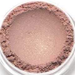 Side view of Heiress vegan mineral eyeshadow in light golden pink, showcasing shimmer texture and compact case