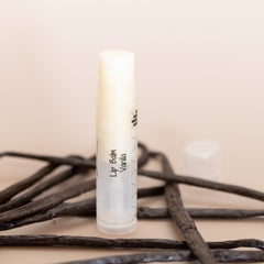 Lip balm tube with white and clear plastic, HandCraft Skincare Vanilla flavor, with vanilla beans