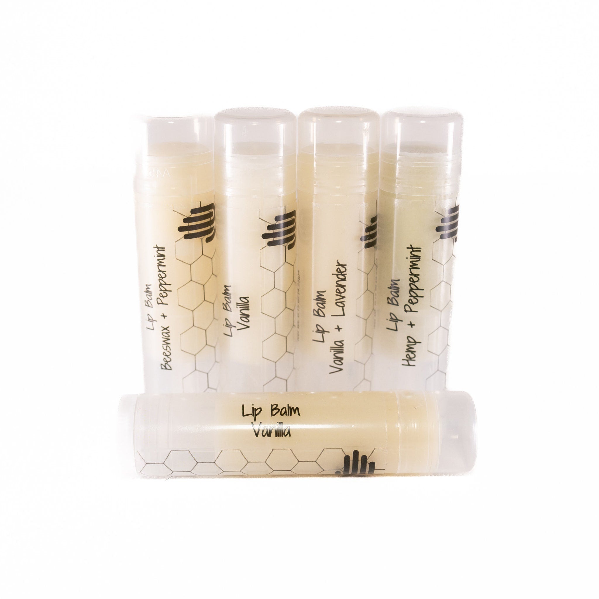 Lip balm tubes with clear plastic, light beige balm, and black text labels with a honeycomb pattern