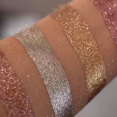 Close-up of Molten Shadow Diamond Luxe eyeshadow palette with shimmering metallic shades in gold and bronze tones