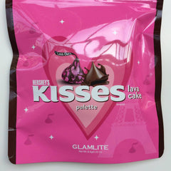 Hershey's Kisses palette, pink plastic packaging, chocolate kiss graphic, Glamlite brand text visible
